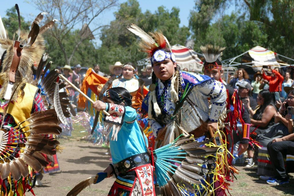 Indigenous people perform a vibrant traditional dance.